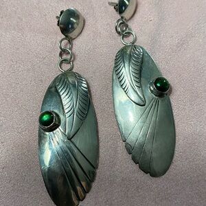 Silver pierced Earrings with unknown jewels